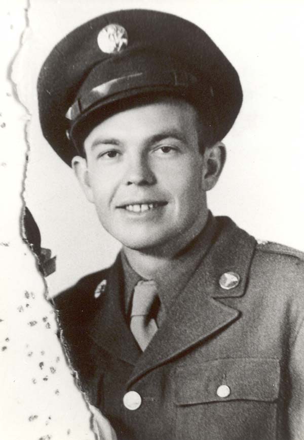 Frank in an Army uniform, left edge torn