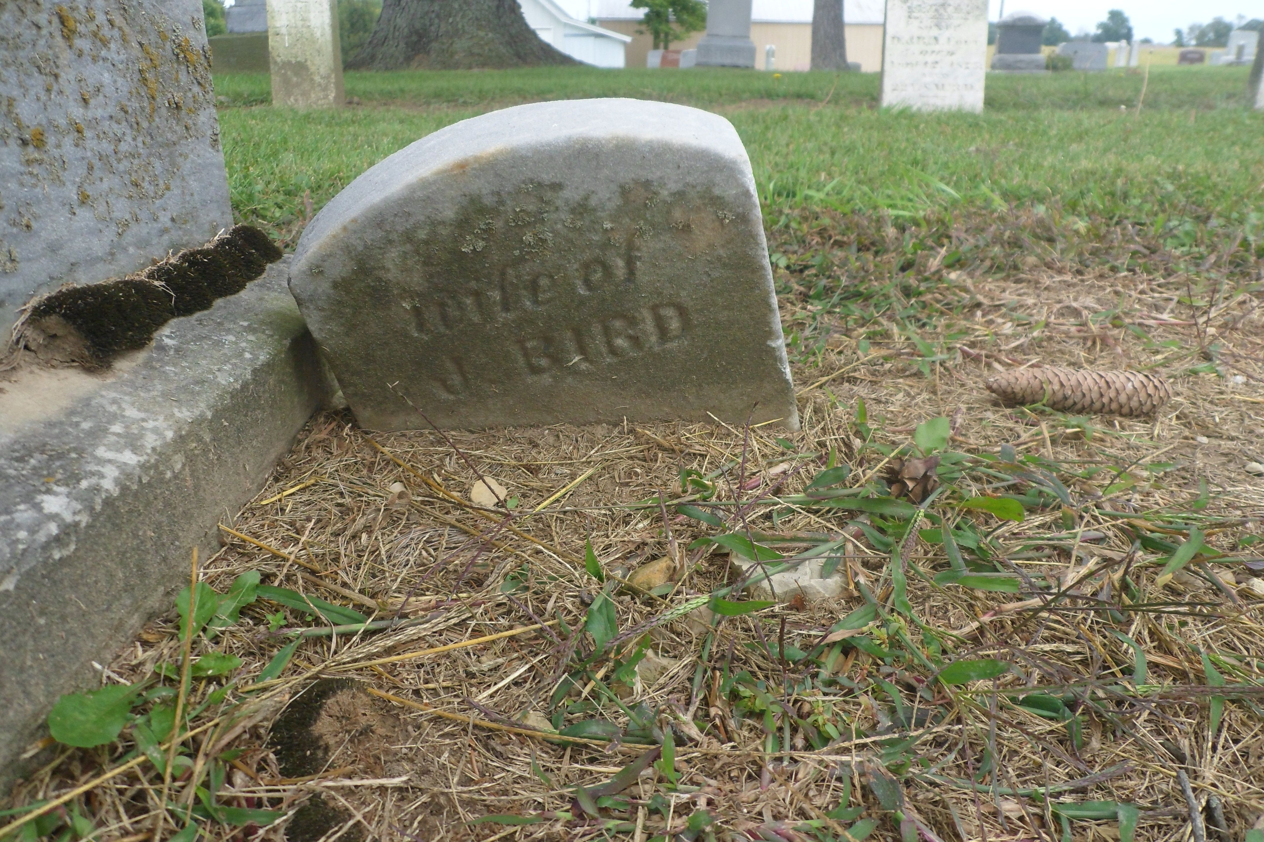 Side of the monument showing James's information