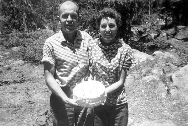 Frank and Florence, holding a birthday cake together