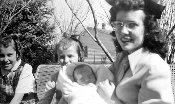 Two girls and Bertha (Langfield) Mahler holding her infant son George