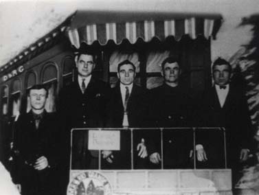 Jacob Mahler and others on the back of a train car